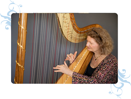 Dominique playing - through the harp